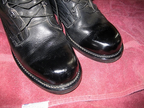 Showing the shine of black boot.