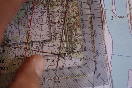 Land navigation measuring distance on topo topographic map.