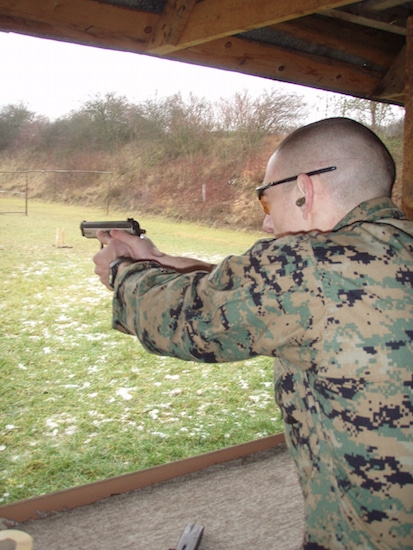 Marine shooting target practice handgun and gougles.