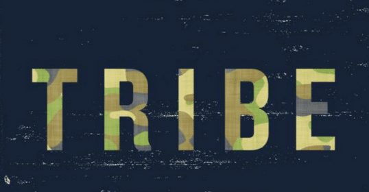 A tribal symbol on a dark background.