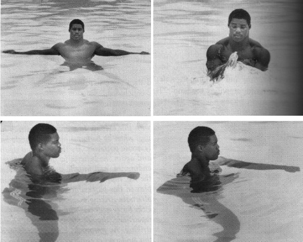 Herschel Walker in water pool doing exercises.
