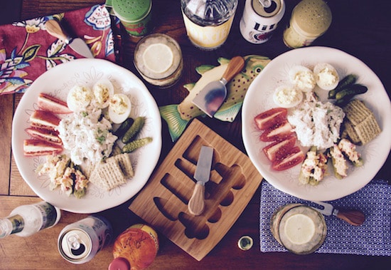 Two plates of food on a wooden table perfect for a cold supper.