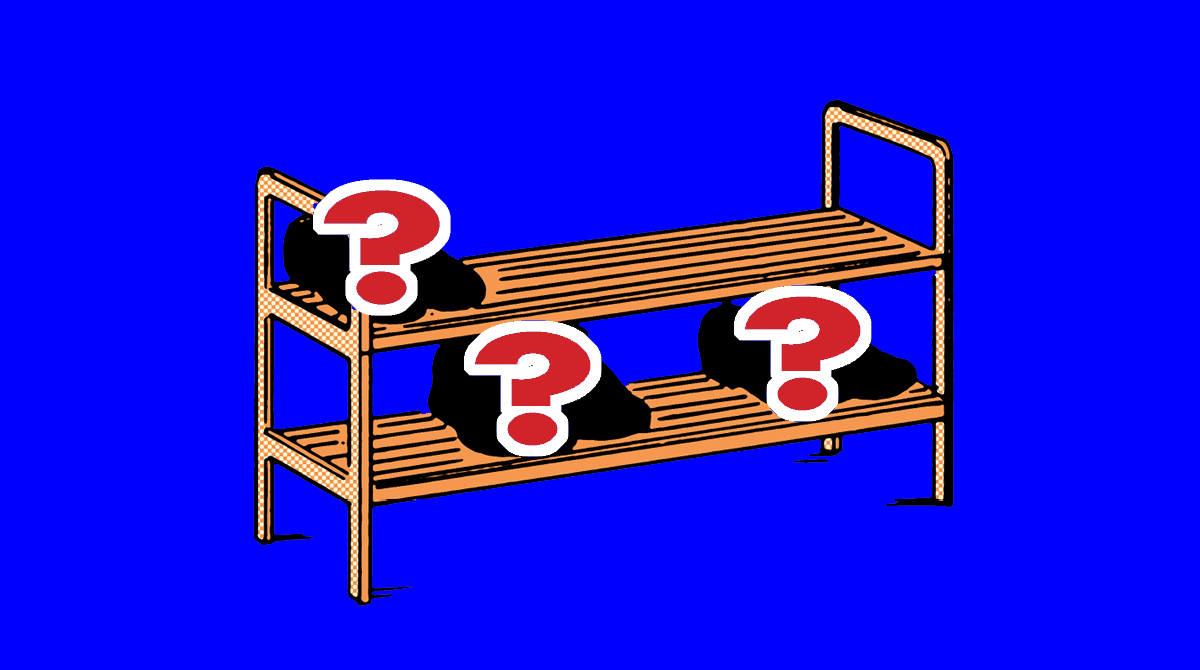 A wooden shelf with question marks, perfect for a man's minimalist wardrobe of shoes.