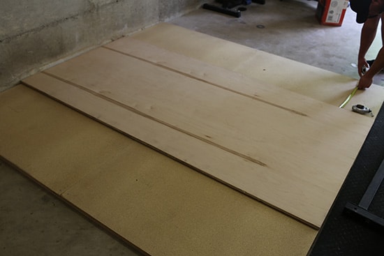 Man Measuring Plywood.
