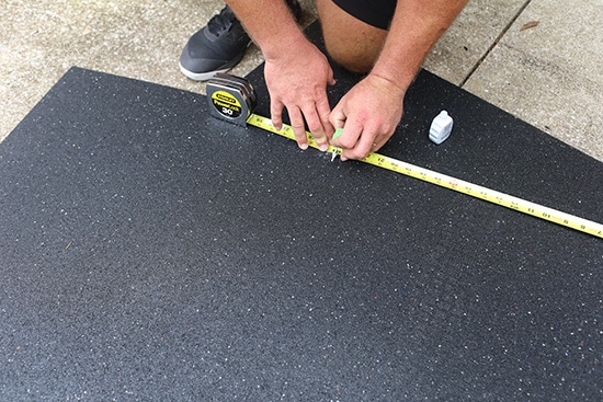 Man Measuring Mat.