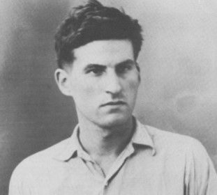 A black and white photo of a man in a shirt, possibly Philippe Viannay.