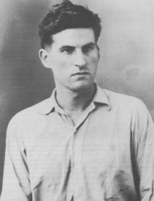 A black and white photo of a man in a shirt, possibly Philippe Viannay.