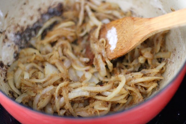 Homemade beef stroganoff stirring in flour starch.