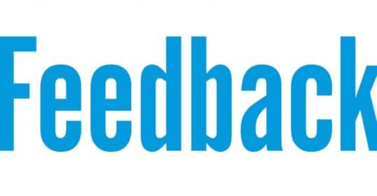 The word feedback in blue on a white background, taking feedback.