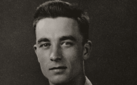 A black and white photo of a man in uniform exudes wisdom.
