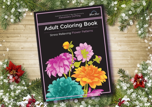 Adult coloring book on the decorated board.