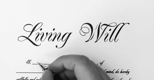 A man signing advance directives.