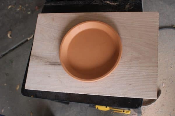 diy wooden plant hanger drip tray sitting on board