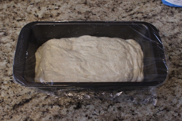 A cover of dough with loaf pan.
