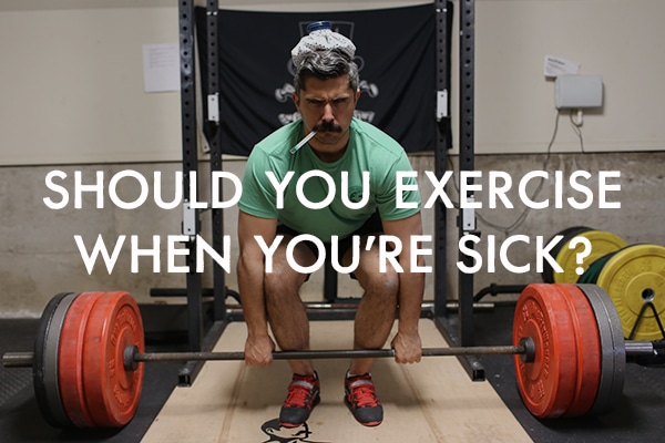 Man lifting barbell sick with thermometer and ice pack.