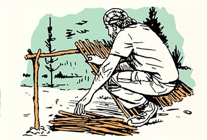 A person crouching and working on a wooden fence outdoors, practicing the Skill of the Week: Make a Survival Lean-To.