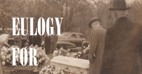 A black and white photo of a man standing next to a casket with the word Eulogy for Alex.