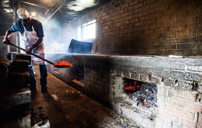 Men burning coals.