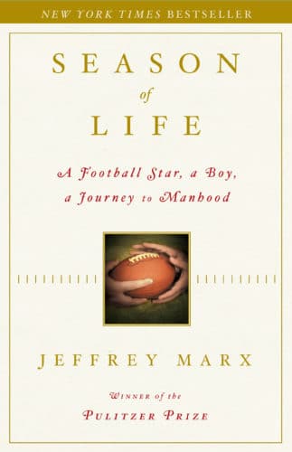 Season of life, by jeffrey marx, book cover hands holing a ball.