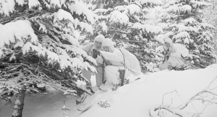 Finnish soldiers camouflaged in snow white uniforms wwii.