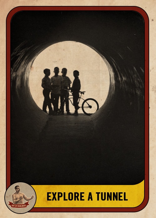 Vintage boys standing at the end of a tunnel.
