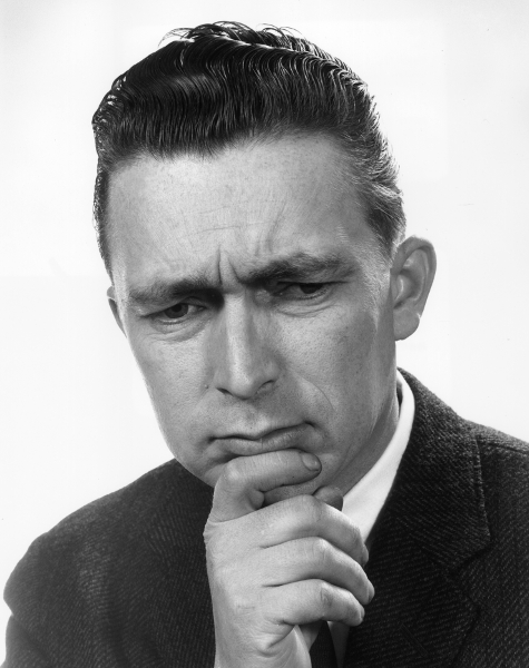 Vintage man looking down with pensive look on face.