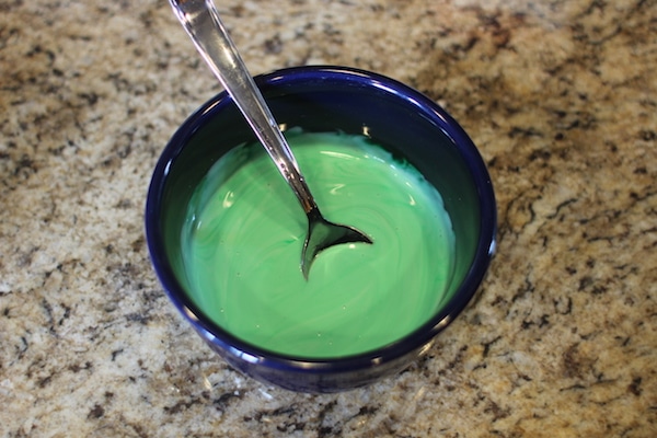Green food coloring mixed with glue homemade diy slime.