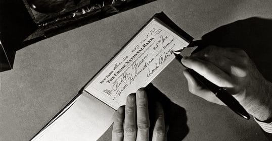 vintage man writing check