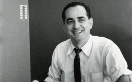A man sitting at a desk with papers in front of him as part of his morning routine.