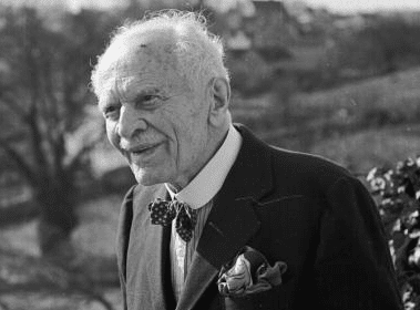 A black and white photo of a successful older man in a suit.