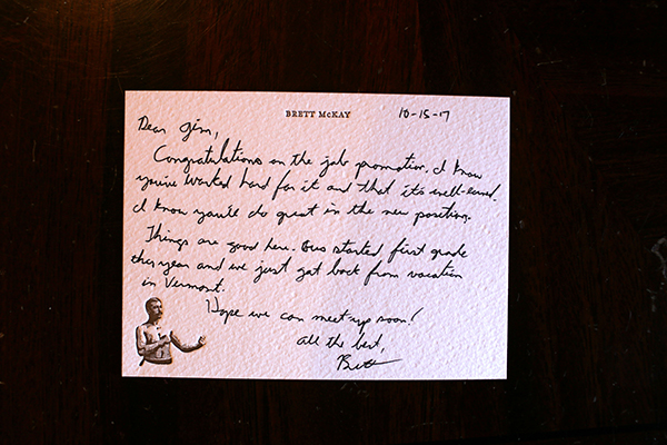 Informal letter on postcard displayed.