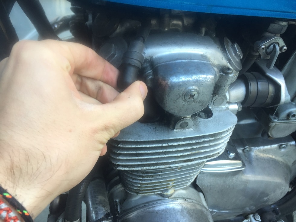 To change motorcycle spark plug cover.