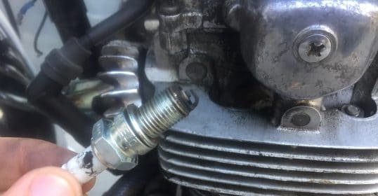 Learn how to change a spark plug on your motorcycle with this easy guide.