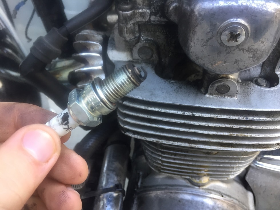Learn how to change a spark plug on your motorcycle with this easy guide.