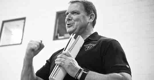 A black and white photo of a man giving an inspiring speech.