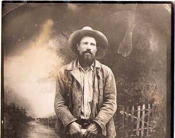 An old photograph of a man in a cowboy hat from the Wild West.