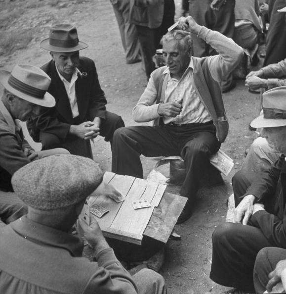 Vintage older men playing cards. 