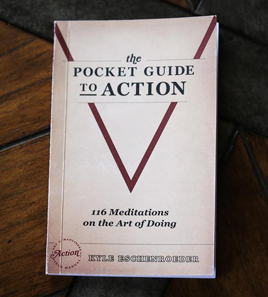 The pocket guide to action book on the table.