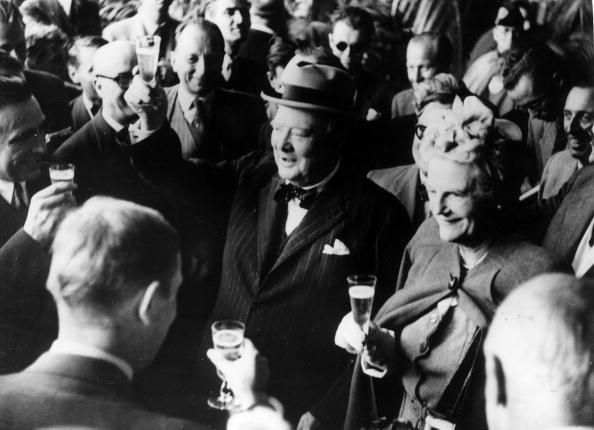 Winston and clementine churchill giving a toast.