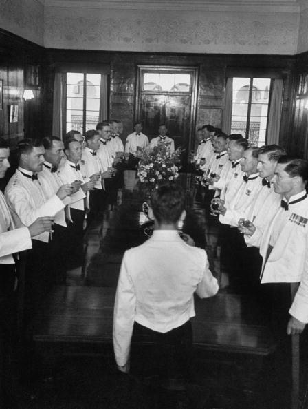 Vintage group of men giving a toast.