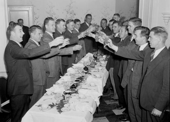 Vintage group of men giving a toast.