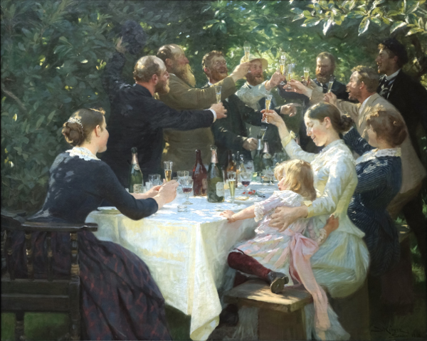 Group of peoples giving a toast in open garden under the branches of trees.