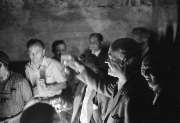 Vintage black and white man giving toast. 