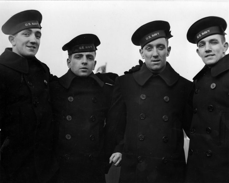 Vintage US navy seamen wearing pea coats.