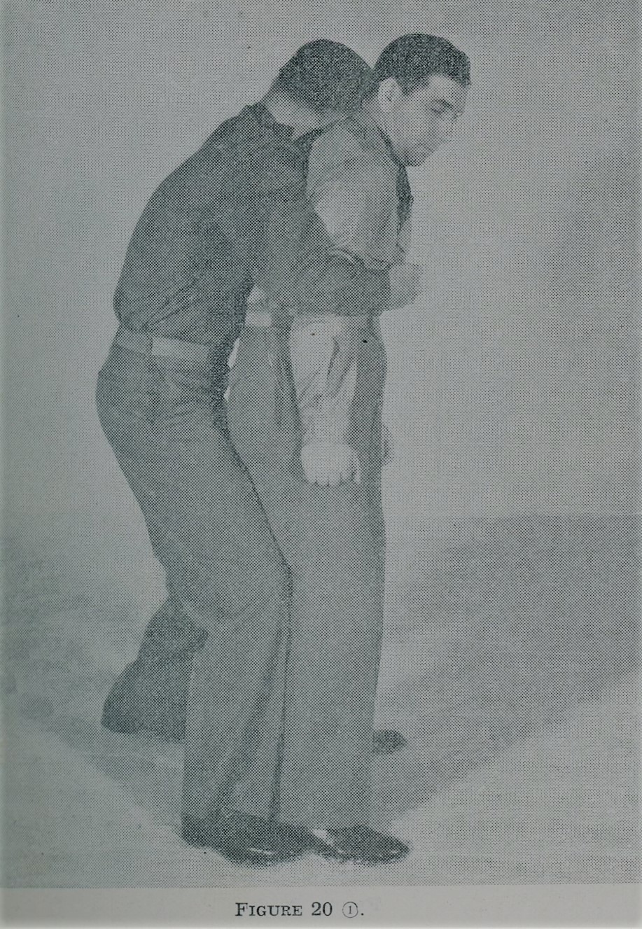 Man escaping from first rear overarm body hold during self defense.