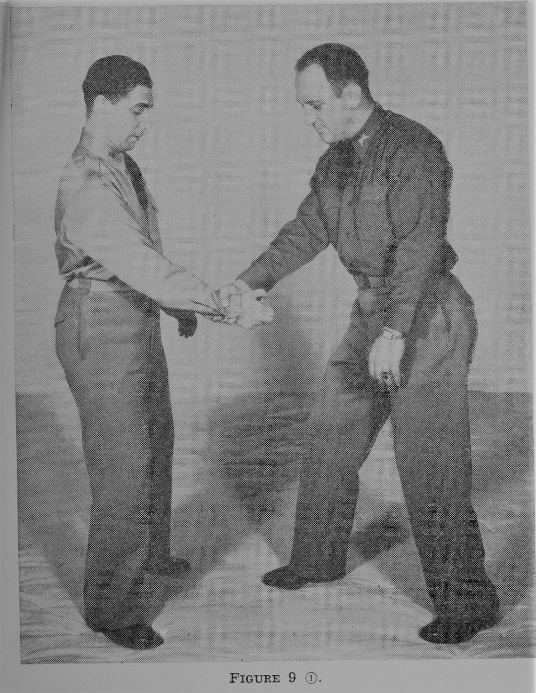 Two men teaching self defense.