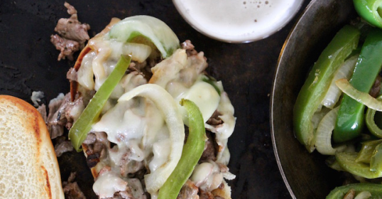 An authentic Philly Cheesesteak on a plate.