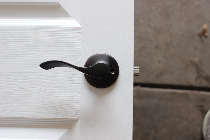 Inserted door knob with latch unit displayed.
