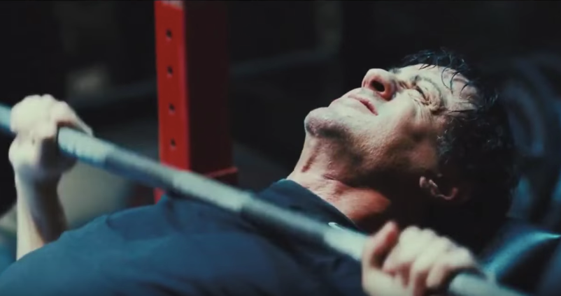 Rocky doing bench press.