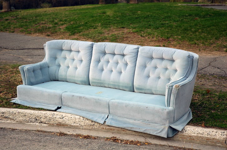 Light blue sofa placed near a walking track.